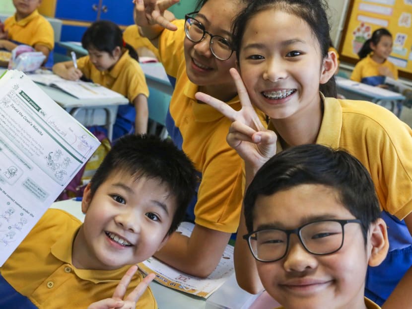 Happy students with test papers